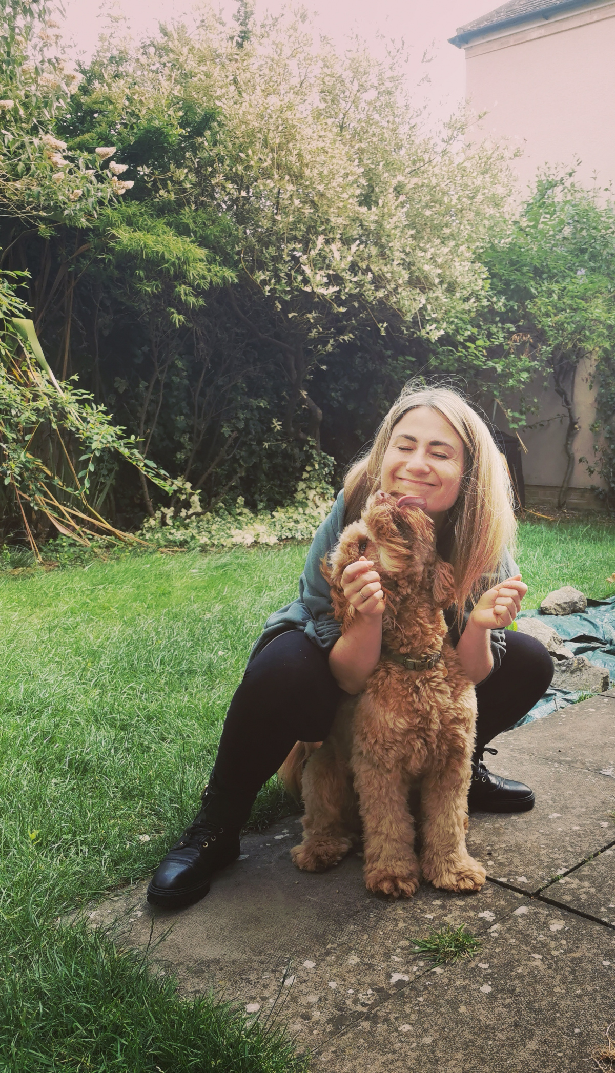 Affectionate Alf and I Kamila, the Ruff Pooch's primary dog trainer, and her dog Alf, excited to see her and trying to give her kisses.